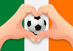 Balón de fútbol de Irlanda y forma de corazón de mano vector
