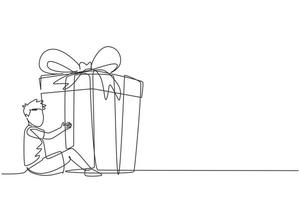Continuous one line drawing happy little boy sitting and hugging huge gift box with ribbon bow wrapped in front of his in arms. Children accept birthday gift or present. Single line draw design vector