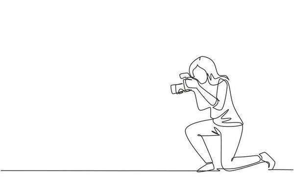 Single one line drawing photographer woman taking pictures. Photo equipment for journalist. Camera digital with high resolution. Studio photography. Continuous line draw design vector illustration