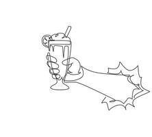 Single one line drawing hand holds glass milkshake with whipped cream through torn white paper. Cold soft drink for summer. Sweet beverage. Tasty and yummy fast food continuous line draw design vector