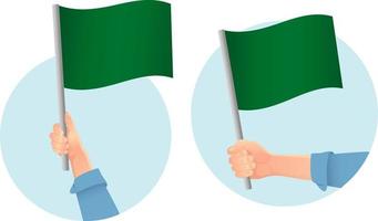 icono de bandera verde en la mano vector