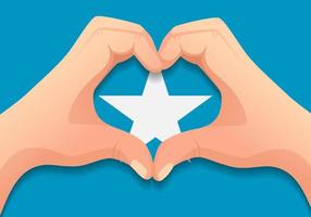 bandera de somalia y forma de corazón de mano vector