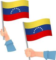 icono de la bandera de venezuela en la mano vector