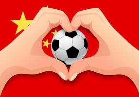 balón de fútbol de china y forma de corazón de mano vector