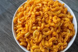 Bowl of macaroni and cheese top down flat lay photo
