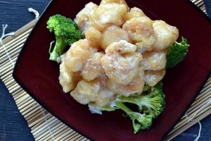 Chinese coconut shrimp on brocklie flat lay photo