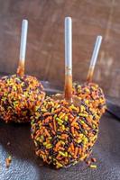 Fall colored candy caramel apples photo
