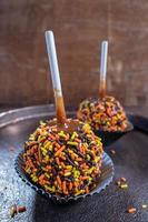 Fall colored candy caramel apples photo