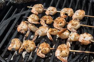 shrimp kabobs on the charcoal grill outdoors photo