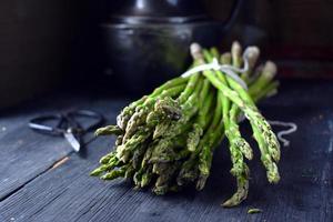 Fresh Asparagus bundle in rustic farmhouse setting photo