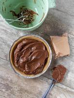 flat lay of chocolate pudding pie in graham cracker crust photo