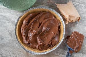 flat lay of chocolate pudding pie in graham cracker crust photo