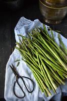 Fresh Asparagus bundle in rustic farmhouse setting photo