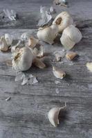 garlic bulbs on rustic wood top view photo