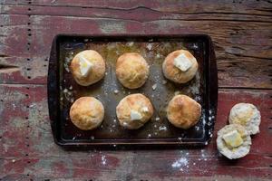 Homemade country biscuits with butter flat lay photo