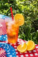 ice tea with lemon in Fourth of July picnic table outdoors photo