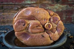 Cooked Thanksgiving ham with bone side profile photo