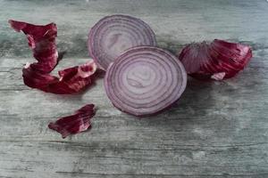 sliced red onions on rustic wood photo