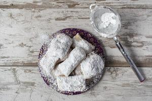 New Orleans french beignet with powdered sugar top view photo