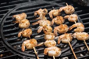 shrimp kabobs on the charcoal grill outdoors photo