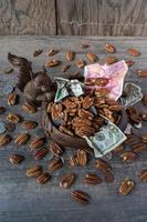 squirrel with bowl of nuts and money photo