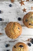 homemade blueberry muffins on rustic wood top view