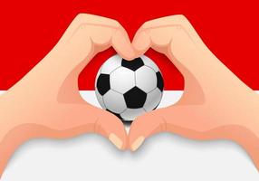 balón de fútbol de indonesia y forma de corazón de mano vector