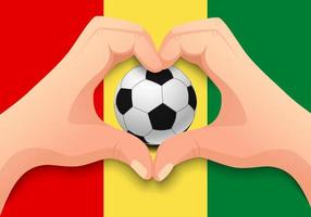 balón de fútbol de guinea y forma de corazón de mano vector