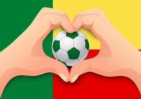 Balón de fútbol de benin y forma de corazón de mano vector