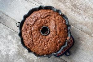 baked carrot cake in bundt pan flat lay photo