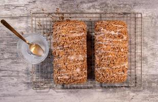 flat lay of two of baked pumpkin streusel bread loafs photo