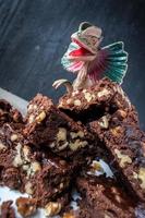 fun kid's dinasaur over stack of homemade Walnut and chocolate brownies photo