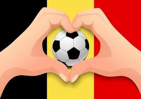 Balón de fútbol de Bélgica y forma de corazón de mano vector