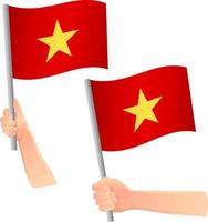 icono de la bandera de vietnam en la mano vector