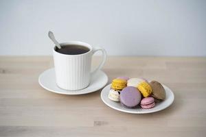 Cup of tea, a teapot and a cake on a blue background. photo