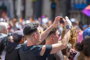 San Francisco, CA, USA - June 22, 2022, Pride Parade, 2 men watching the parade photo
