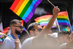 San Francisco, CA, USA - June 22, 2022, Pride Parade, parade members carrying pride flags photo