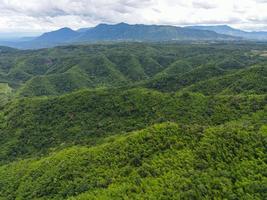Aerial view forest trees background jungle nature green tree on the mountain top view , forest hill landscape scenery of river in southeast Asia tropical wild photo