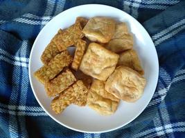 Tahu and tempe goreng or Fried Tofu and tempeh on a plate. Indonesian culinary food photo