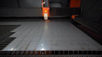 Laser cut, industry. CNC laser cutting machine. Machine that cuts aluminum, steel and metal sheets. Drills and drills holes in sheet metal. Automatic and programmable machine.