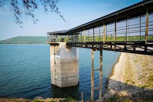 Water level meter Landscape with dam lake mountain reservoir with tower Water level meter photo