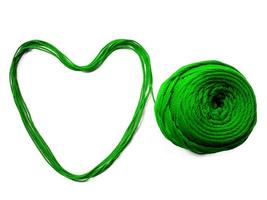 Knitting yarn heart shaped isolated on white background photo