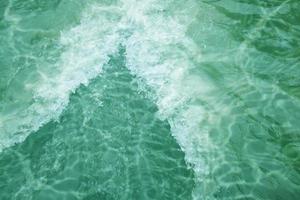 Defocus blurred blue watercolor in swimming pool rippled water detail background. Water splash, water spray background. photo