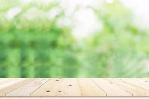 Table top on green blurred background,Space for placing products photo