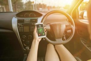 Close-up of woman call smartphone with car insurance concept photo