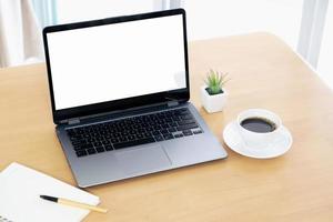 Laptop and gadgets on table photo