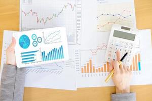 Close-up Of Businesswoman With Digital Tablet And Document photo