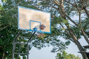 Swish - basketball goes through the hoop photo