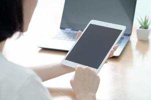 Business woman using laptop and smart phone stock photo