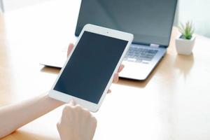 Business woman using laptop and smart phone stock photo